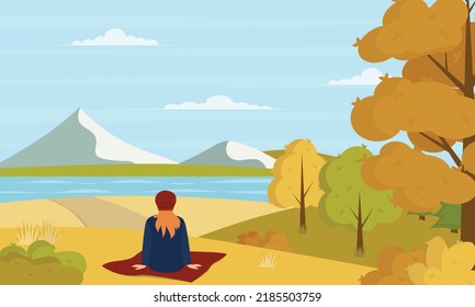 Back view portrait of a woman sitting contemplating views at sunset