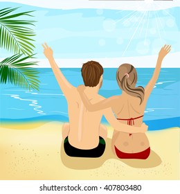 back view of young couple at tropical beach with arms up