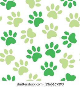 backdrop with silhouettes of cat or dog footprint. green Vector illustration animal paw track pattern. Paw print seamless.