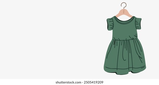 Background or banner with green baby dress on a hanger, advertising and sale of children's clothing, copy space
