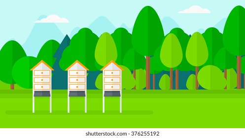 Background of beehives in meadow.