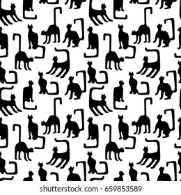 Background with black and white cats. Seamless vector pattern with geometrical kittens inspired by ancient Egyptian art. Ethnic textile collection.