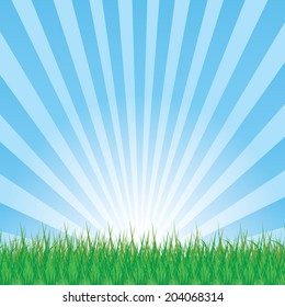 Background with a blue sky, and green grass.