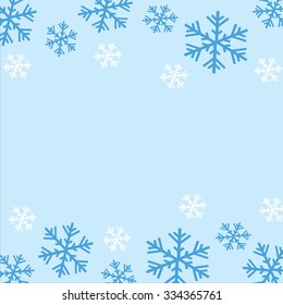 Background of blue and white snowflakes with space in the middle