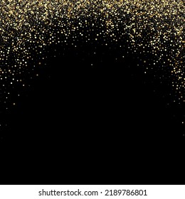 Background of bright glowing gold dust on black.Abstract background gold glitters