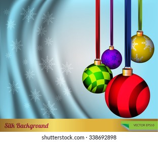 Background with Christmas balls and silk.