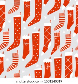 Background with Christmas stockings. Seamless pattern for gift wrapping or fabric design.