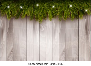 Background with christmas tree branches and baubles in front of a wooden wall. Vector.