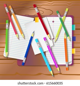 Background with color pencils. Empty notebook with and color pencil around on the table. Vector background.