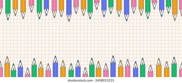 Background with colored pencils. Grid paper and numerous pencils. Learning and homework. Education at school. Beginning of the school year. School time. Notebook with pencils on a grid background