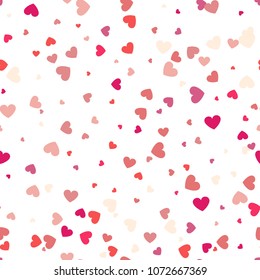 Background with different colored confetti hearts for valentine time. Seamless pattern