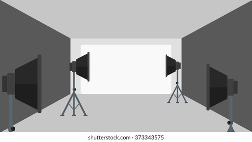 Background of empty photo studio with lighting equipment.
