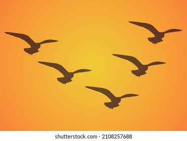 Background of flock of birds flying in the sunset