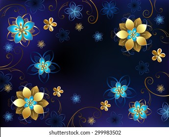 Background with gold jewelry and blue flowers.