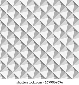 Background from gray volumetric pyramids. The illusion of volume. Vector seamless pattern.