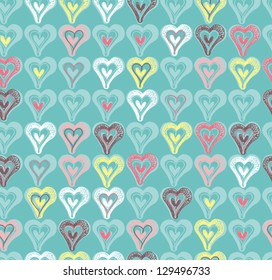 Background with hearts. Seamless pattern with cute colored hearts.