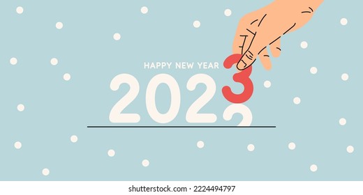 Background with the inscription Happy New Year 2023. A person holds a number in his hand.