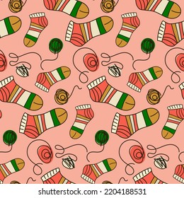 Background in knitted socks with tangles. Knitting warm socks with knitting needles. Suitable for printed products on paper and fabric. Hobby knitting for yourself and for sale.