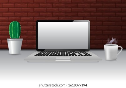 background of laptop cup of coffee and cactus on brick wall