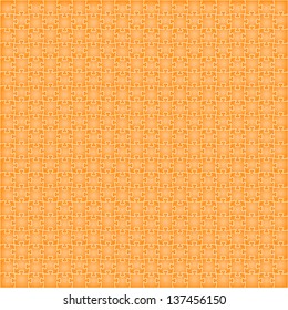 The background made out of isolated orange puzzle pieces / puzzle background