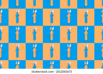 Background from a metal adjustable wrench with a rubber handle. Tools seamless pattern.