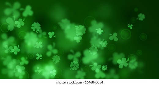 Background on St. Patrick's Day made of blurry clover leaves in green colors