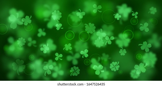 Background on St. Patrick's Day made of blurry clover leaves in green colors