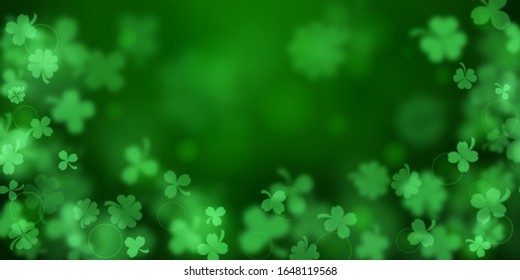 Background on St. Patrick's Day made of blurry clover leaves in green colors
