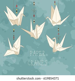 Background with paper cranes. Origami bird figures