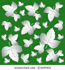 background with paper leaves on green