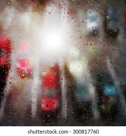 A background with a parking with colorful cars and raindrops. Not auto-trace. 