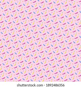Background or pattern for the design in the form of a candy sprinkle on pink.