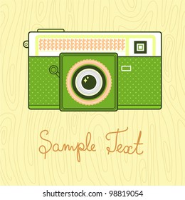 Background with retro camera. Vector illustration. Camera with wood pattern.