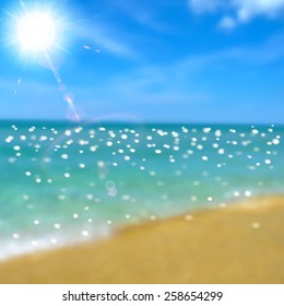 Background with sea, beach and sun with lens flare