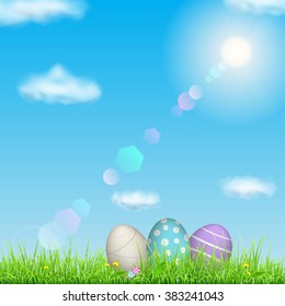 Background with sky, sun, grass, easter eggs and flowers