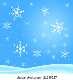 Background of snowflakes falling onto snow - blue background