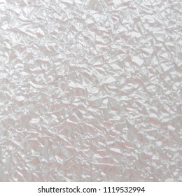 Background texture of crumpled foil sheet. Light Abstract silver background. Vector illustration.