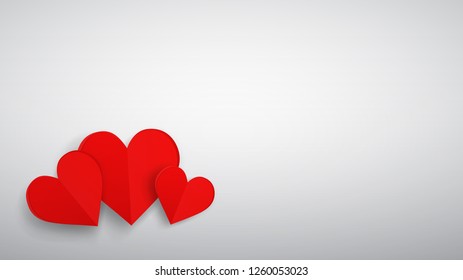 Background with three red paper volume hearts, red on white