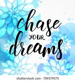 Background with watercolor imitation and abstract florals. Chase your dreams handwritten modern calligraphy message. Blue colored.