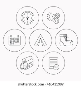 Backpack, camping tend and hiking boots icons. Compass linear sign. Check file, calendar and cogwheel icons. Vector