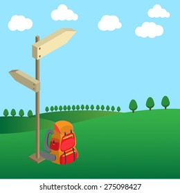 backpack with wood guide post on green field tree and clouds on clear sky