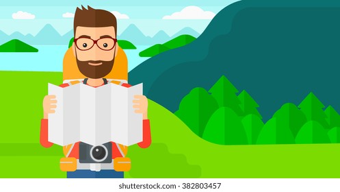 Backpacker looking at map.