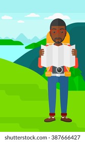 Backpacker looking at map.
