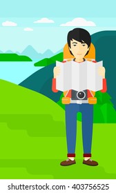 Backpacker looking at map.