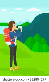 Backpacker taking photo.