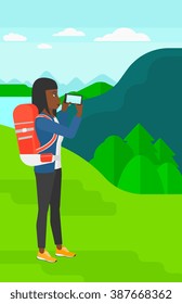 Backpacker taking photo.
