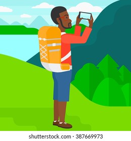 Backpacker taking photo.