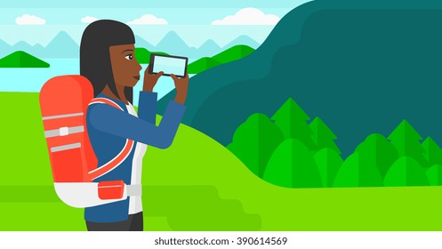 Backpacker taking photo.
