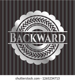 Backward silver badge or emblem