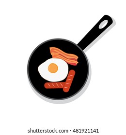 Bacon and egg in black pan with handle, top view